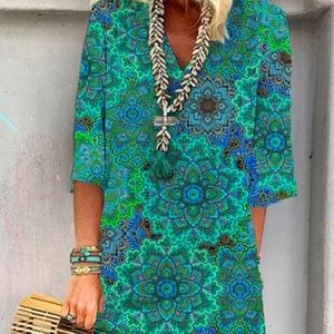 Multicolored v-neck dress.  Soft patterned material in shades of blue and green.